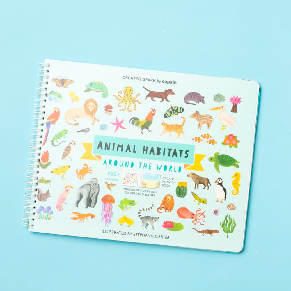 Children's activity book titled 'Animal Habitats Around the World' on a blue background